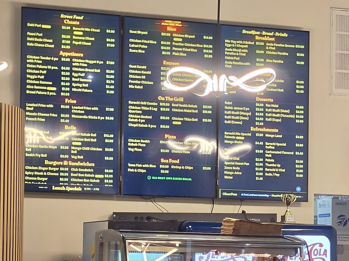 Karachi Chaat House — three-screen menu wall